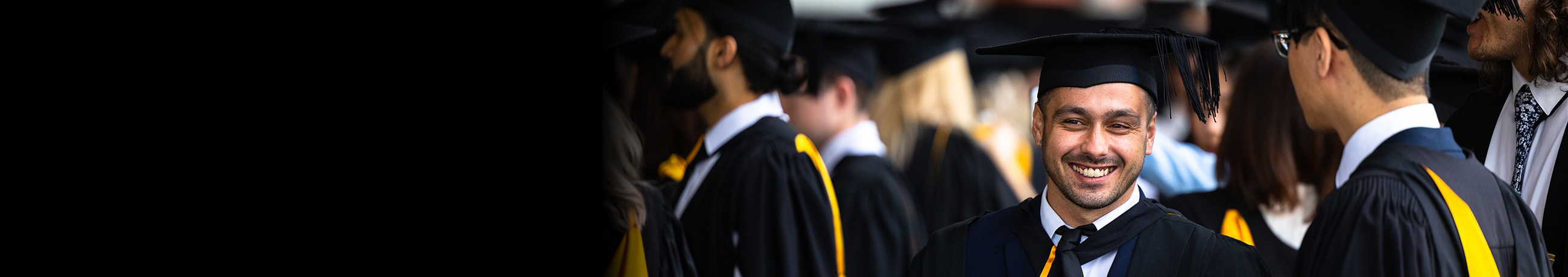 graduating-student-smiling-towards-camera