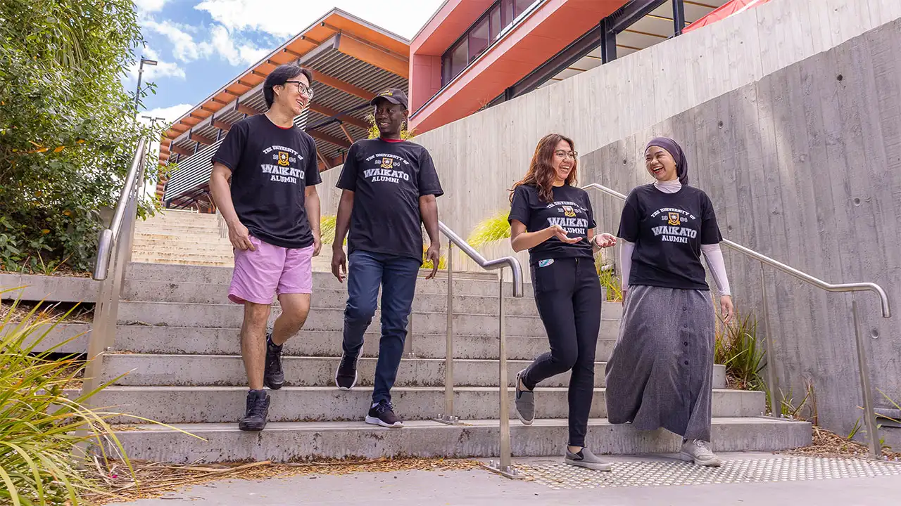Happy students descending the stairs