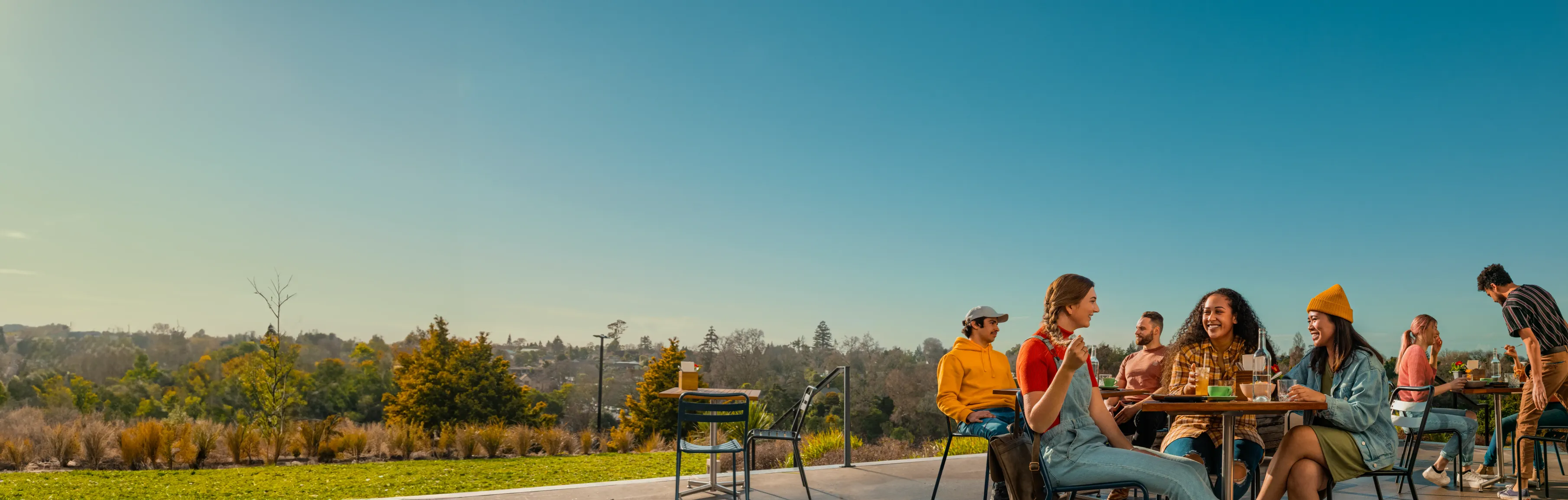 students-sitting-outside-sunny-day-desktop
