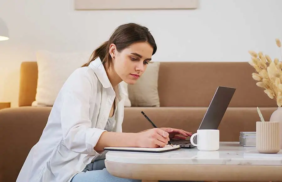 lady at table writing