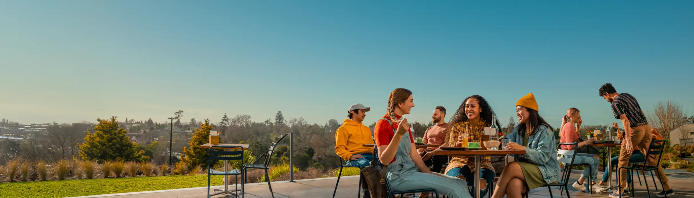 students-sitting-at-cafe-outside-desktop